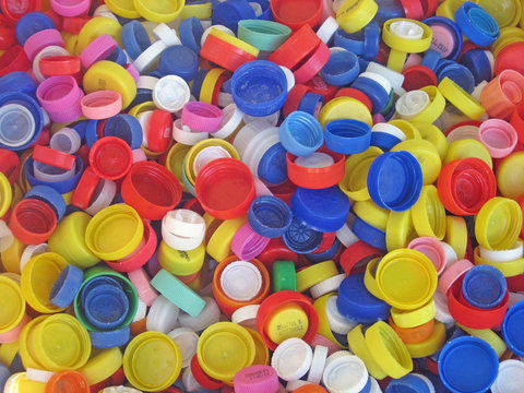recycling of a collection of colored plastic caps for bottles