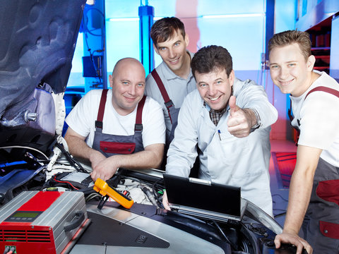 Motor mechanics are satisfied with tuning the engine of a car