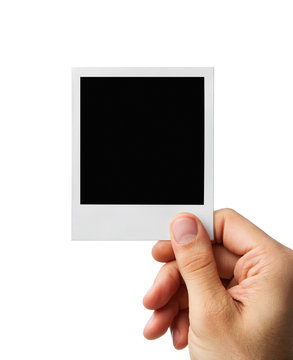 Male hand holding blank instant photo frame, clipping path inclu