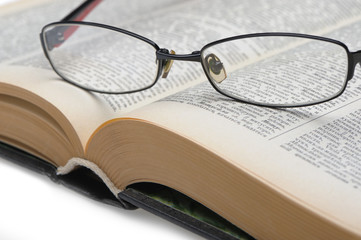 Eyeglasses on the old opren book