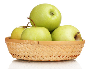 juicy green apples in the basket isolated