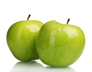 two juicy green apples isolated on white
