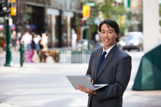 Business Man Portrait Outdoor with Laptop