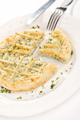 tasty quiche with cheese and herbs