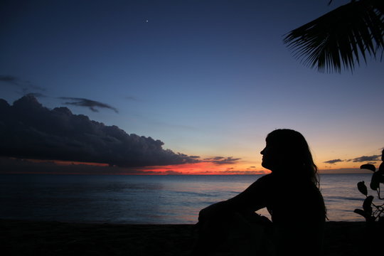Woman's profile at the sunset