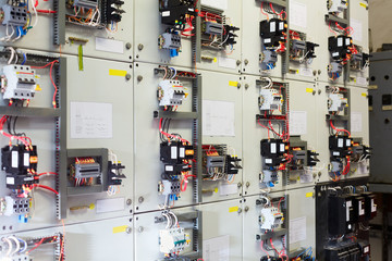 Electric service panel with many switches and breakers