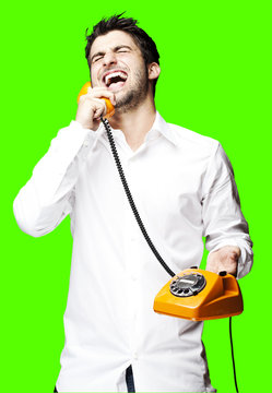 man holding telephone over removable chroma key background