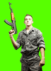 young soldier isolated over removable chroma key background