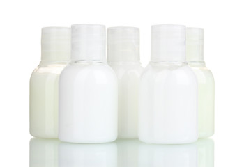 small cosmetic bottles isolated on white