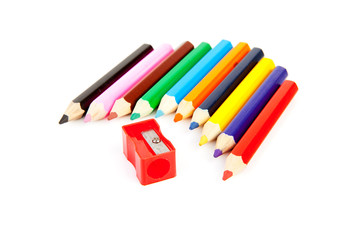 colorful pencils in a row with sharpener