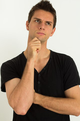 Man thinking with hand on face