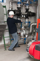 employee tightens the screw