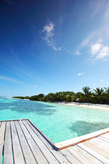 Fototapeta na wymiar resort maldivian houses in blue sea
