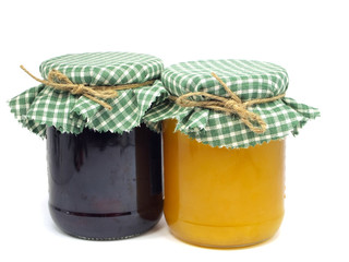 plum jam and honey in glass jars