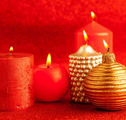 christmas candles group on red glitter
