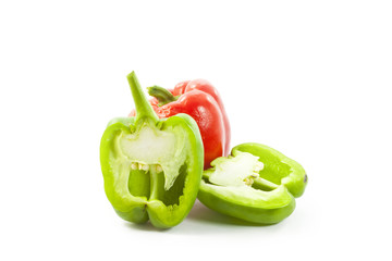 red and green paprikas on white background