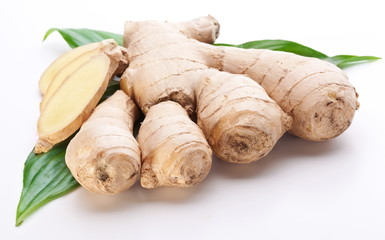 Fresh ginger with leaves isolated on white background.