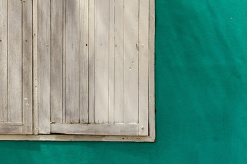 old white wood window and green painted wall