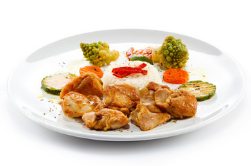 Fried chicken nuggets, white rice and vegetables