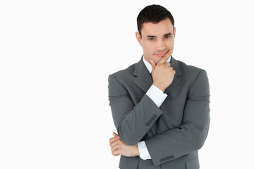 Young businessman lost in thoughts