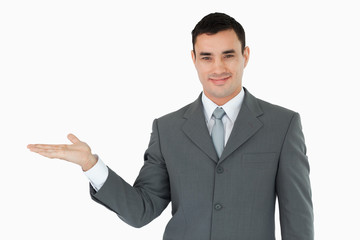 Businessman presenting something in his palm