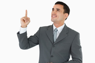 Businessman looking and pointing upwards