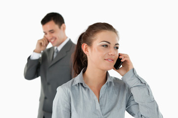 Close up of business partners talking on the phone