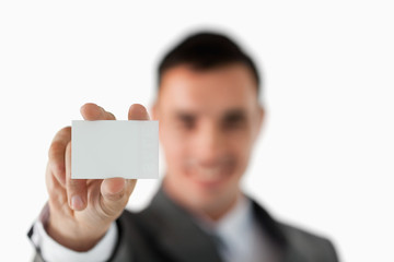 Close up of business card being shown by businessman