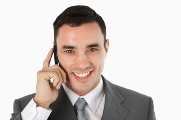 Close up of friendly businessman on the phone