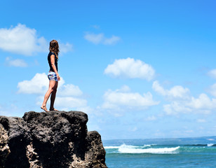 Beautiful woman on the rock