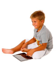 little boy using digital tablet