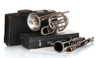 antique trumpet, clarinet and case isolated on white