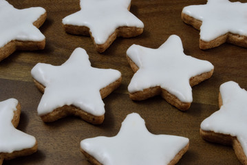 cinnamon star cookies on a wooden board - Zimtsterne