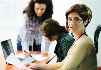 Female executive giving presentation to her colleagues