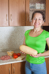Woman with vegetable marrow