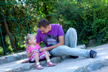 Cute little girl with her father– Outdoor