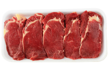 the pieces of raw fillet steaks in box