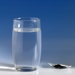 glass of water in blue back