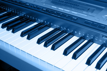 Naklejka premium colored blue photo of electronic piano