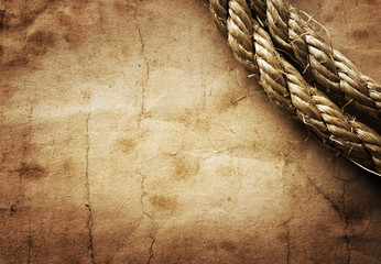 Fototapeta na wymiar aged Rope on the old paper background