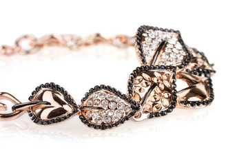 Beautiful golden bracelet with precious stones isolated on white