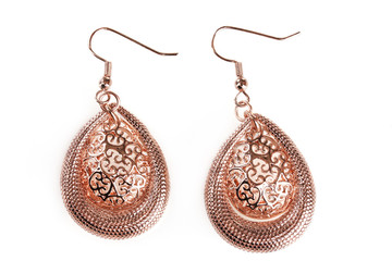 beautiful gold earrings isolated on white