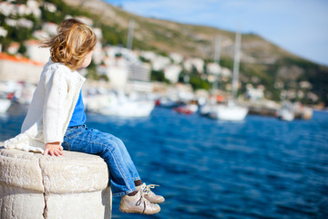 Little girl enjoying sea view