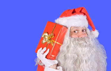 Santa Claus holding a gift