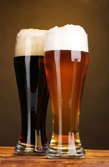 black and golden beer in glasses