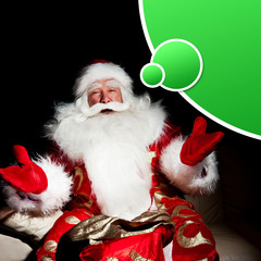 Obraz na płótnie Canvas Santa sitting with a sack indoor at dark night room