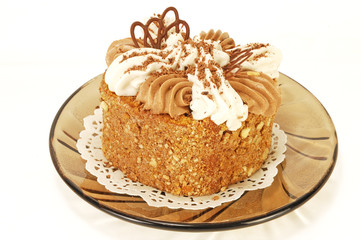 аppetizing fruitcake with a cream close up