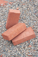 Three red clay bricks