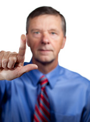 Male executive touches sensor