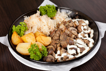 meat with potatoes in the pot